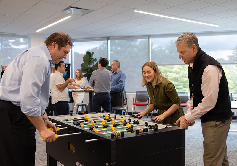 Mural employees engage in some fun play and socializing during a break at the office.